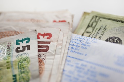 British and American paper currency, close-up.