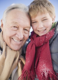 Portrait of grandfather with grandson (8-9) in winter. Photo : Jamie Grill Photography