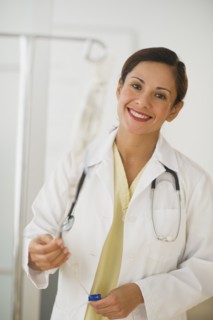 Smiling female doctor with IV drip.