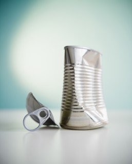 Damaged tin can. Photo : Jamie Grill Photography