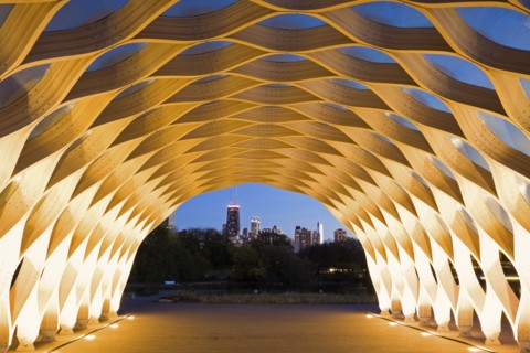 USA, Illinois, Chicago, Illuminated tunnel with city skyline in distance, dusk. Photo : Henryk