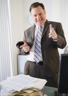 Businessman pointing to camera. Photo : Jamie Grill Photography