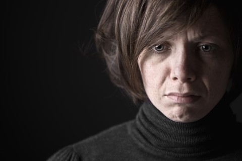 Studio portrait of sad woman. Photo: Justin Paget
