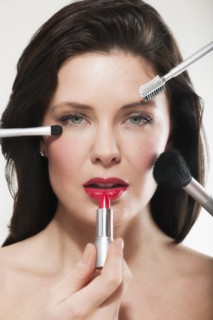 Woman having make up applied.