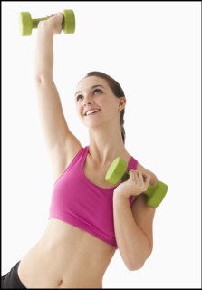Young woman exercising with hand weights. Photo: Mike Kemp