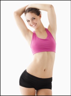 Studio portrait of young woman smiling. Photo : Mike Kemp
