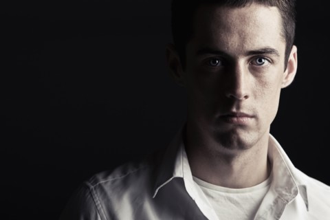 Powerful Low Key Shot of a Serious Looking Teen