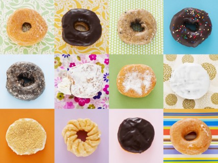 Selection of doughnuts on colorful background.