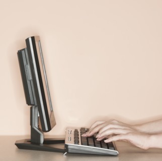 Studio shot of woman working on computer.