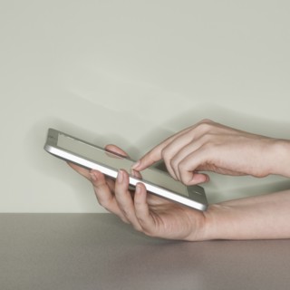 Studio shot of woman with digital tablet.