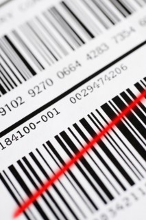 Close up of barcode with red line.