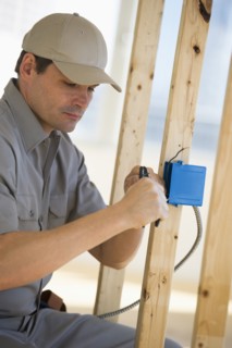 Electrician working at construction site.