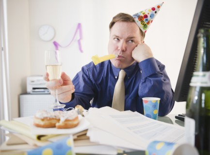 Businessman at office party. Photo : Jamie Grill Photography