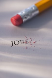 Studio shot of pencil erasing the word jobs from piece of paper. Photo : Daniel Grill