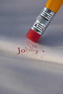 Studio shot of pencil erasing the word jobs from piece of paper. Photo : Daniel Grill