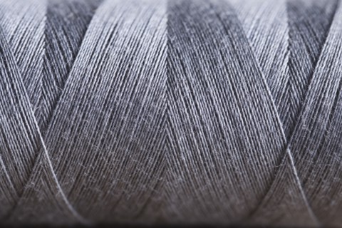 Close-up view of silver string spool. Photo : Kristin Lee