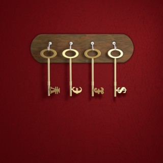 Keys with Yen, Euro, Pound Sterling and Dollar symbol hanging on red wall. Photo : Jon Boyes