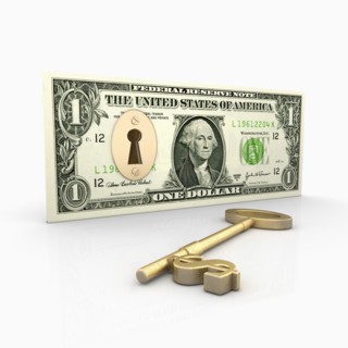 Dollar bill with lock inside, key with Dollar Symbol laying beside. Photo: Jon Boyes