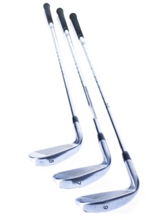 Three golf clubs on white background. Photo : David Arky