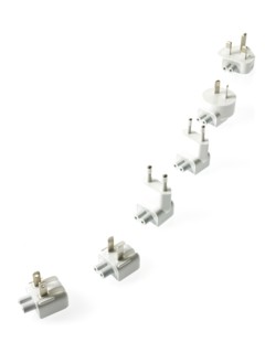 Row of plugs on white background. Photo : David Arky