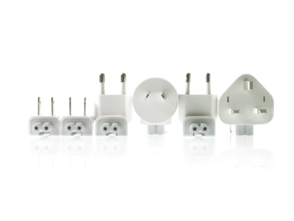 Row of plugs on white background. Photo : David Arky