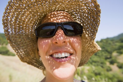 USA, California, Woman wearing straw hat. Photo : Noah Clayton