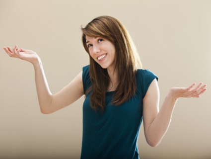 Studio portrait of young woman gesturing. Photo : Mike Kemp