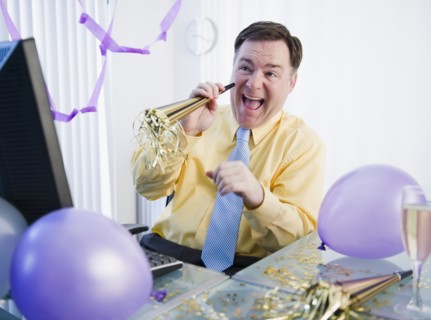 Businessman at office party. Photo : Jamie Grill Photography