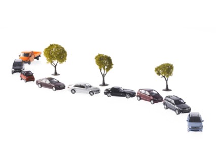 Row on cars on winding road. Photo: David Arky