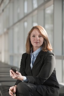Businesswoman text-messaging. Photo: Mark Edward Atkinson