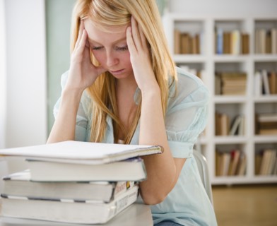 Female student having headache. Photo : Jamie Grill Photography