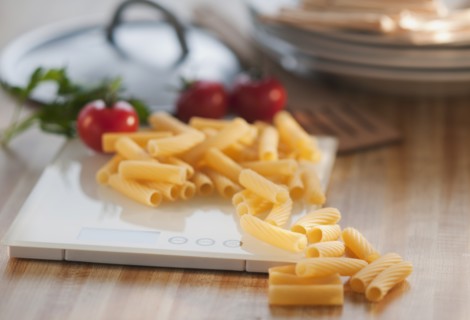 Raw pasta on weight scale.
