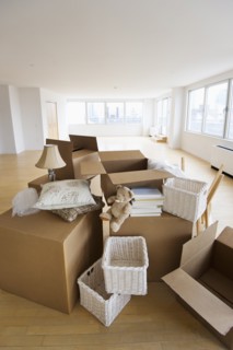 Boxes and decors stacked in room.