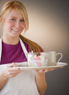 Waitress carrying tray with glass. Photo : Jamie Grill Photography