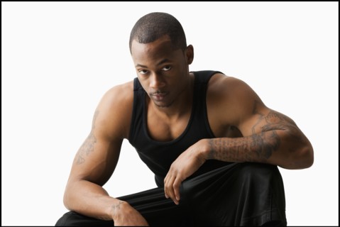 Studio shot of young man in sports clothing. Photo : Mike Kemp