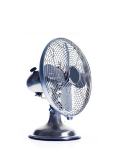 Electric fan on white background. Photo : David Arky