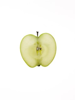 Apple slice on white background. Photo: David Arky