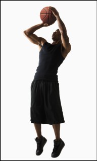 Studio shot of man playing basketball. Photo : Mike Kemp