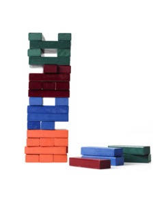 Studio shot of colorful wooden jenga blocks. Photo : David Arky