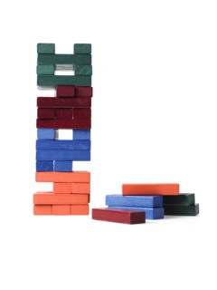 Studio shot of colorful wooden jenga blocks. Photo : David Arky