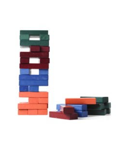 Studio shot of colorful wooden jenga blocks. Photo : David Arky