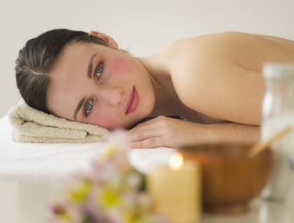 Woman lying on massage table. Photo : Daniel Grill
