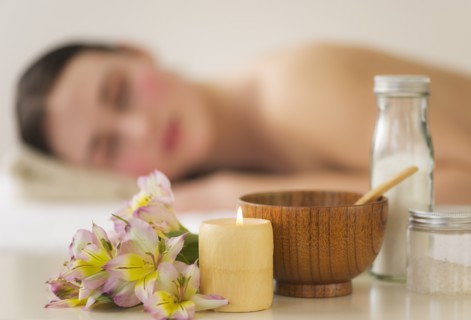Spa accessories with woman in background. Photo : Daniel Grill