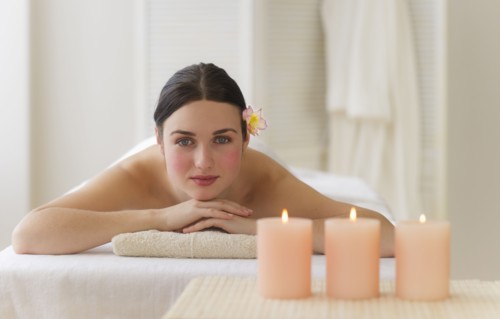 Woman lying on massage table. Photo: Daniel Grill