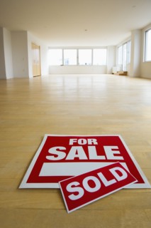 For sale sign in empty room.