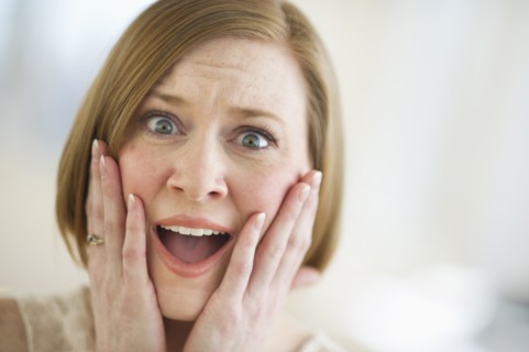 Portrait of shocked woman.