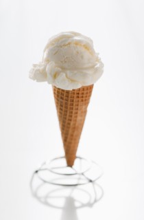 Close up of vanilla ice cream cone.