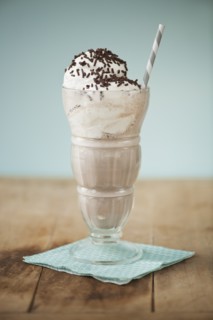 Close up of ice cream soda with chocolate chips.