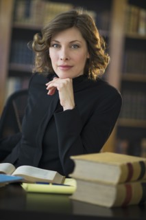 Portrait of woman studying in library.