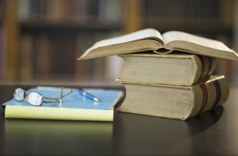 Books on desk in library.